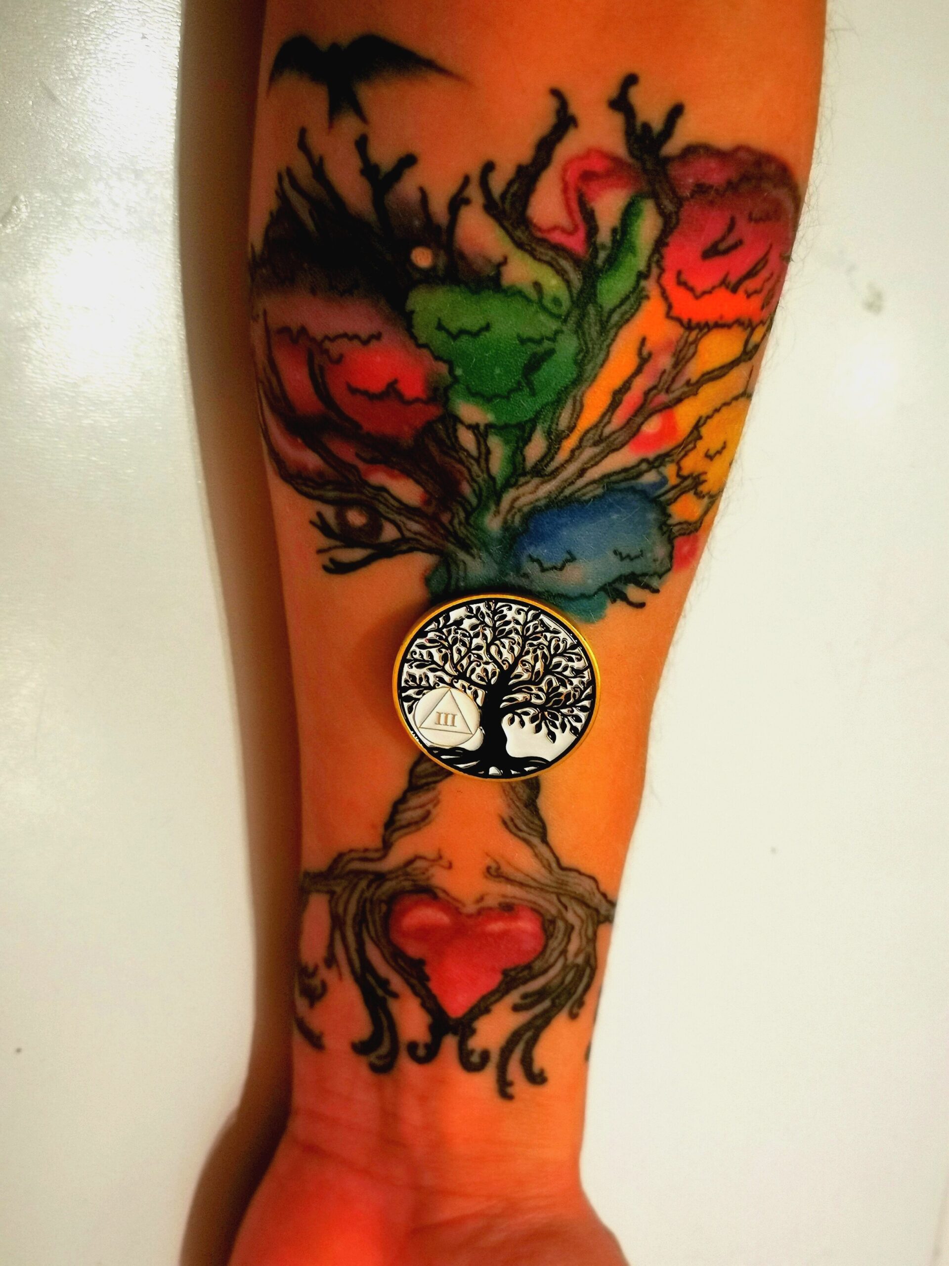 Tattoo an Unterarm bunter Baum